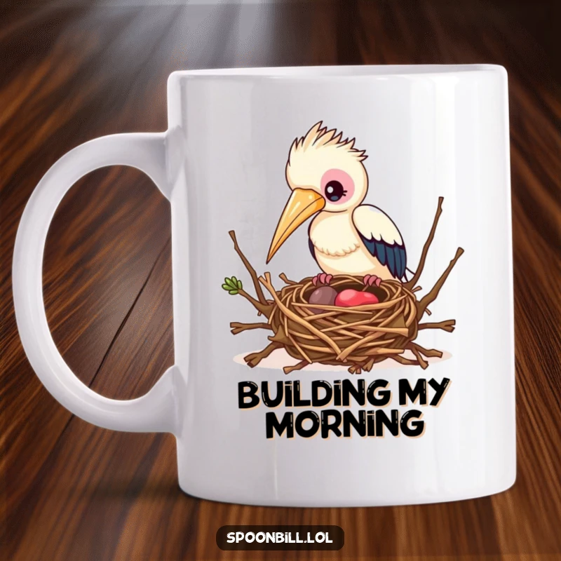 Funny Busy Spoonbill Bird Mug depicting a focused spoonbill bird diligently building an intricate nest with twigs, showcasing dedication.