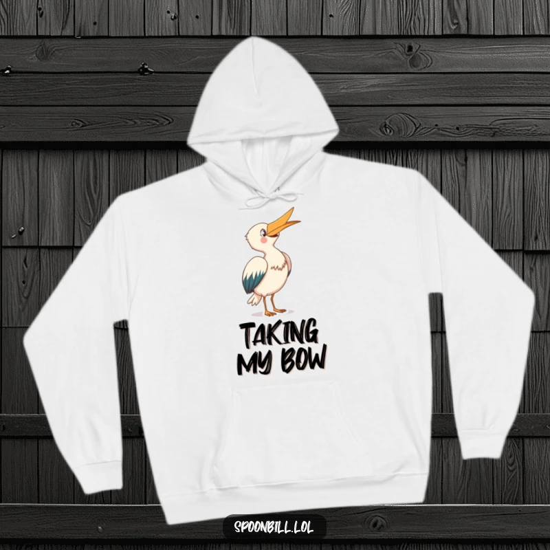 Funny Spoonbill Hoodie: A joyful spoonbill creature with its beak pointed skyward takes a graceful bow, offering cozy humor.