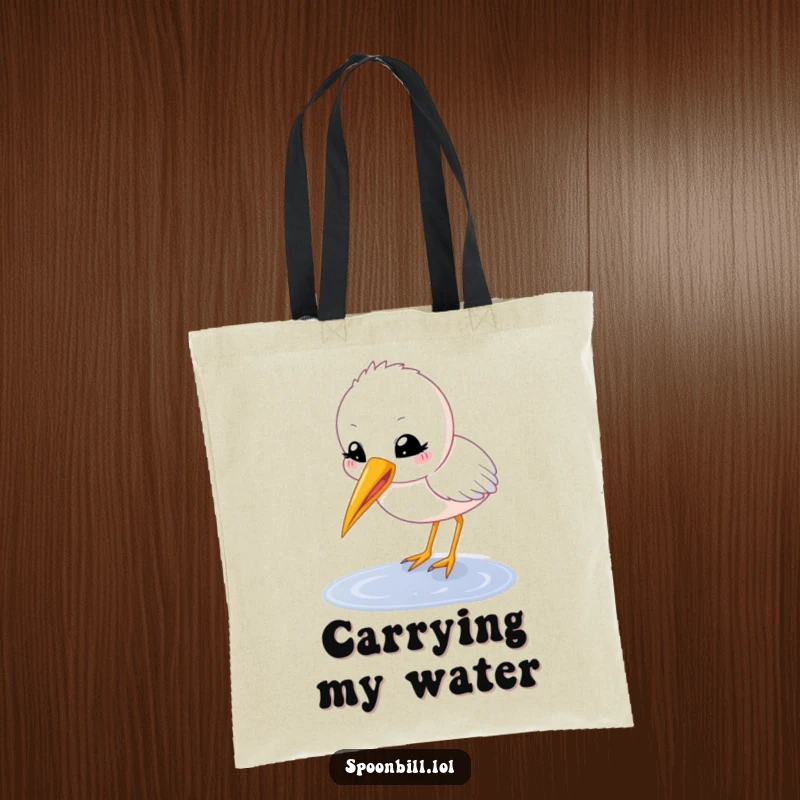 Funny spoonbill chick tote bag with a happy, round character with beak open delicately sipping from a puddle, a stylish and humorous accessory.